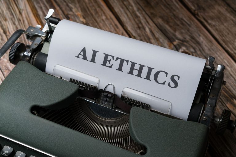 Máquina de escrever antiga com a expressão “AI Ethics” em uma folha de papel.